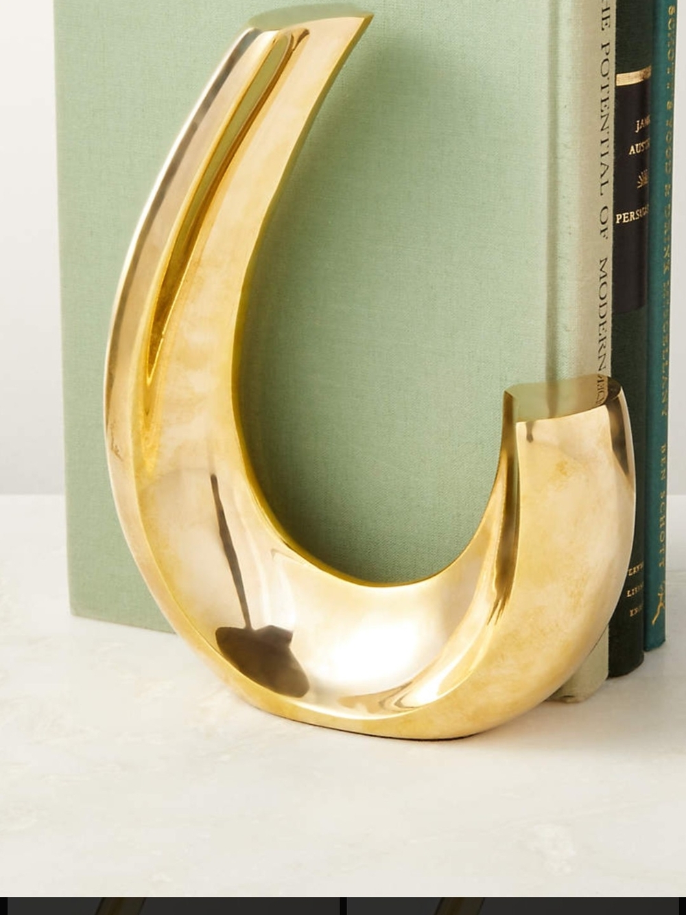 CB2 Polished Gold Curved Sculptural Bookend